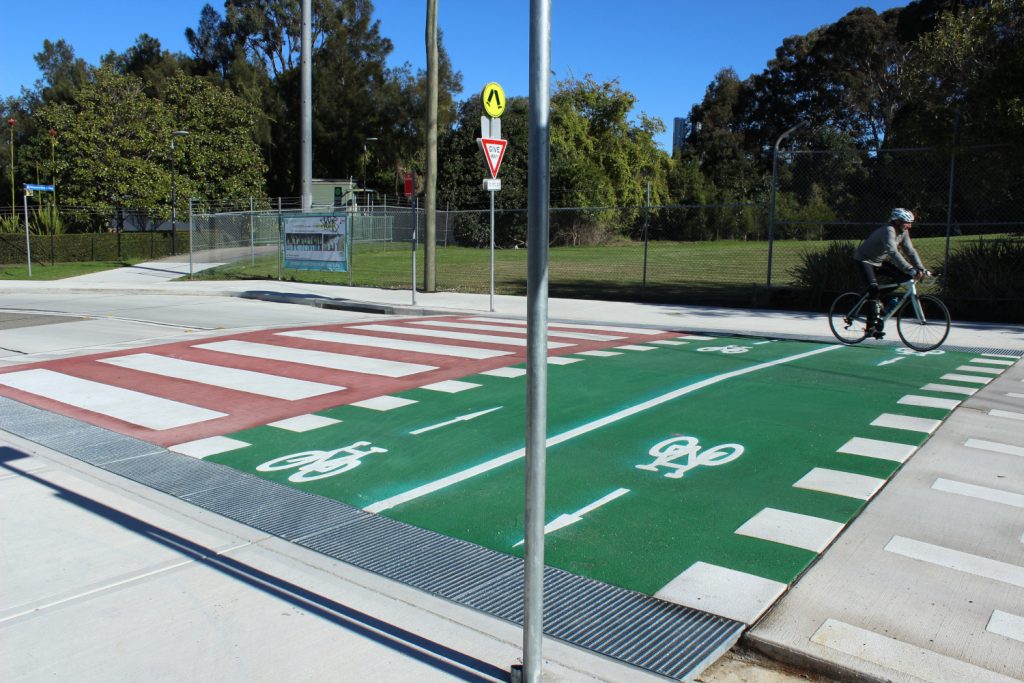 Image shows a crossing with bike lane constructed by COnvil Group